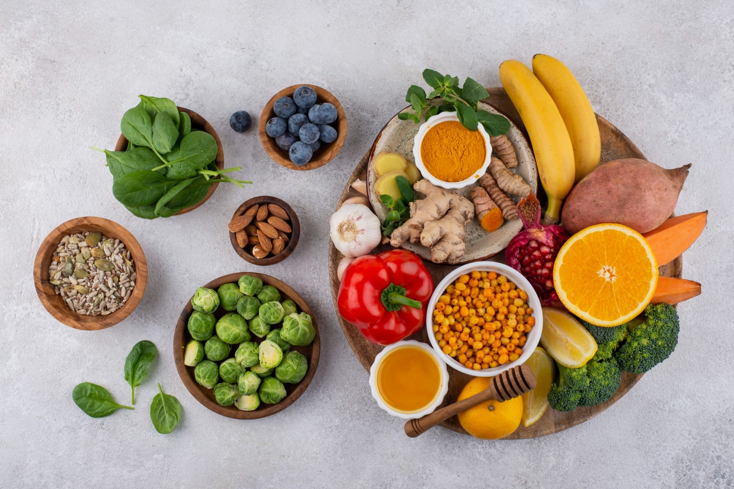 A vibrant selection of superfoods including spinach, blueberries, almonds, and turmeric for energy boost.